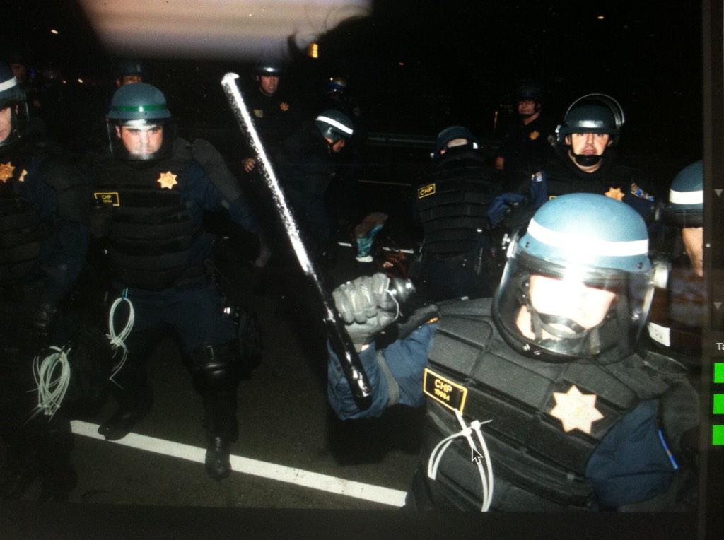 OpBerkeley's tweet photo. Photo of @timhussin's broken lens and the photo he took right before it happened during #berkeleyprotests #OpBerkeley http://t.co/R35hEFGdnx