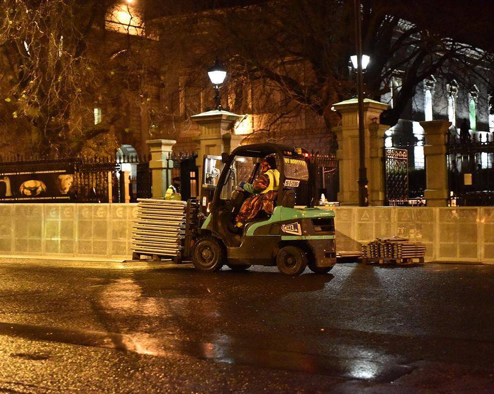 ruairimckiernan's tweet photo. Seems fitting: Denis O'Brien's EventServ company being paid to put barriers around people's parliament. #right2water http://t.co/vbCJ5KpiEc