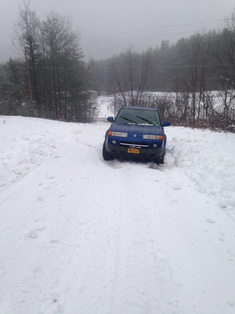 Car stuck halfway up driveway. #fedupwiththeweather