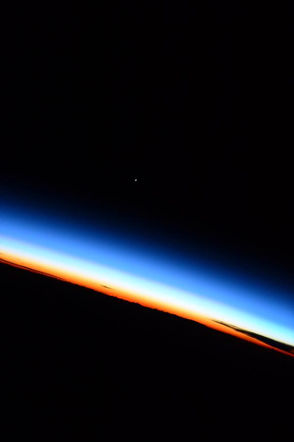 NASA's tweet photo. From @AstroTerry on @Space_Station: 'Venus sits on the background of the Earth's atmosphere.' #ISS http://t.co/3Ti0v2nEWr