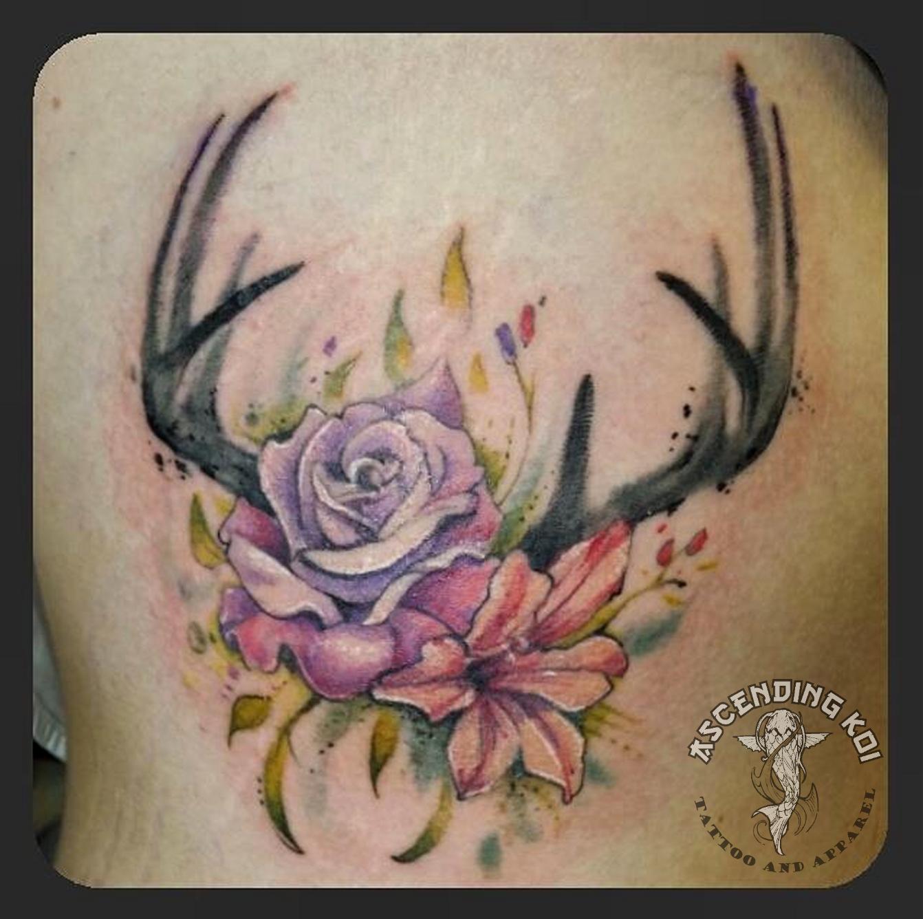 Hi all - I'd like some ideas on a design that integrates antlers with  flowers - something like the photo, but slim enough to be on the inside of  a petite forearm (