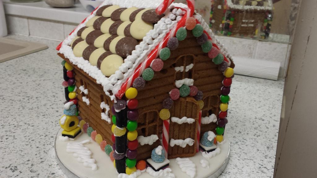 TheShefsTable's tweet photo. return of the gingerbread house. Only one this time! Great fun helping the wife make a works raffle prize. http://t.co/vOy8R3m045