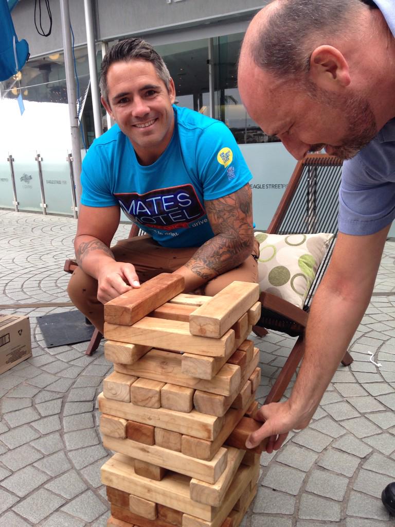 StreetSmartsQLD's tweet photo. Come down to Eagle St Pier and challenge @Coreyjparker13 to some Jenga! #matesmotel http://t.co/L5lAHnrREQ