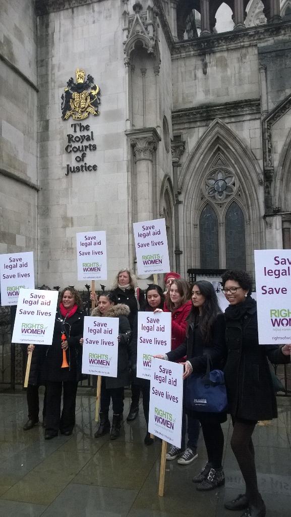 TheLawSociety's tweet photo. .@rightsofwomen outside the Royal Courts of Justice protesting against cuts to #legalaid #savelegalaid http://t.co/KvzcMcAfGk