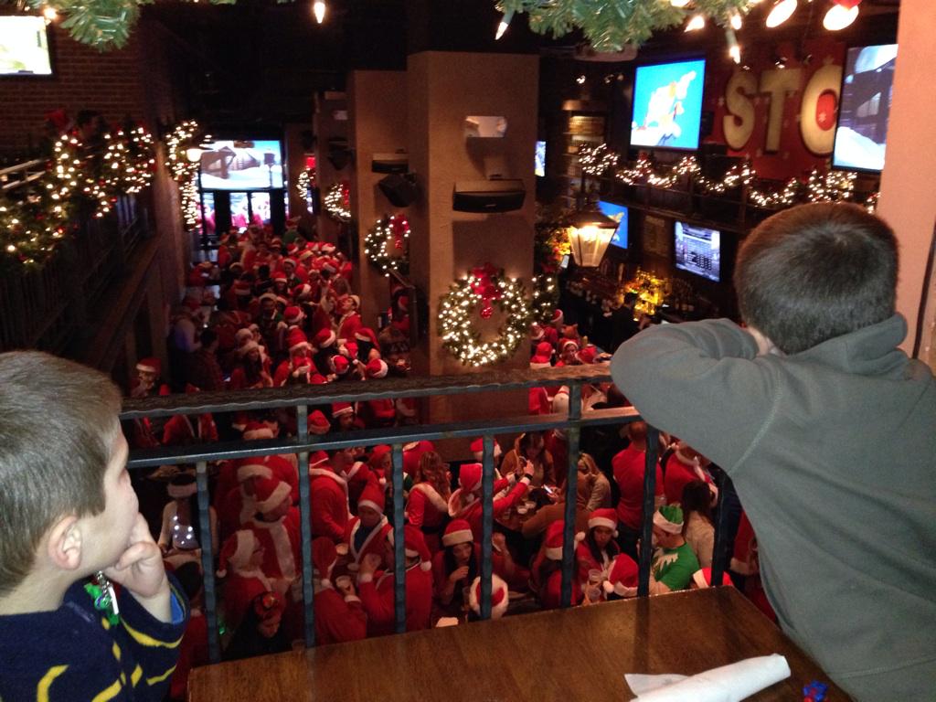 KristyFriedman's tweet photo. Quick lunch before seeing the Grinch at MSG. Santa-Con insanity is keeping these two entertained. #hohoho http://t.co/VAIj4KhCh9