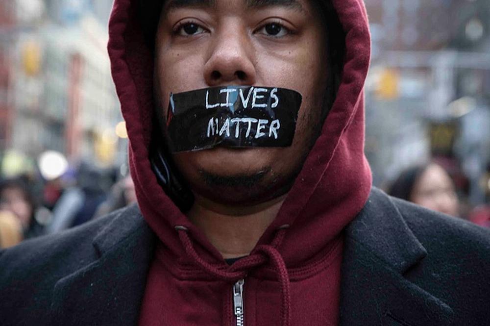 NPRCodeSwitch's tweet photo. Faces from today's on-going #MillionsMarchNYC rally. http://t.co/68Fnj3SNnh via @nprnews (pics via @GettyImages) http://t.co/u1vRge5sAz