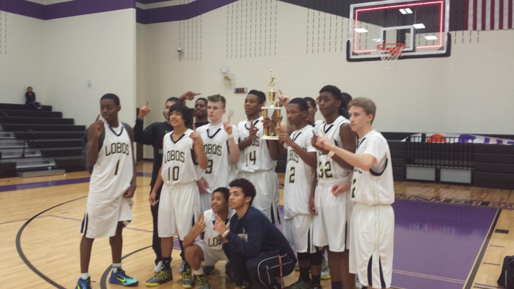 Jv boys basketball win the first district tournament with alyjah cooper making the game winning putback