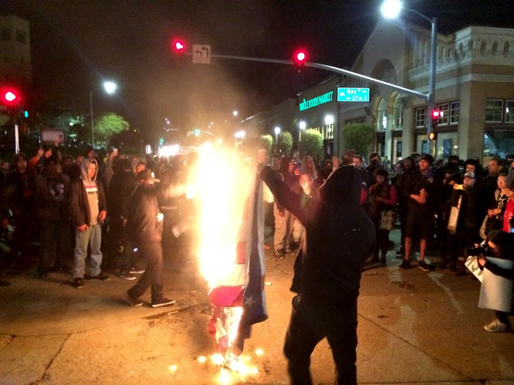 Leftists thugs burn American flag in Oakland