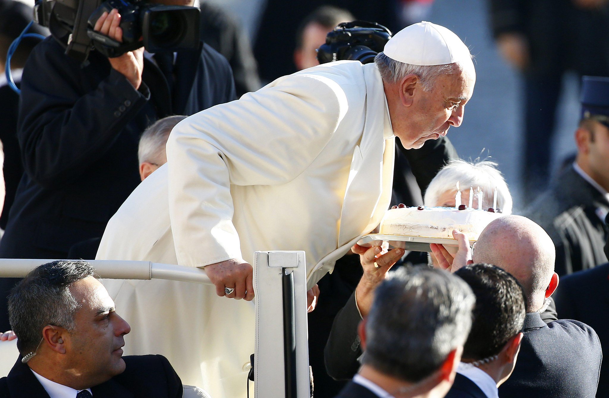 "  Pope Francis blows out candles on a cake for his 78th birthday.  HAPPY BIRTHDAY PAPA!!    "