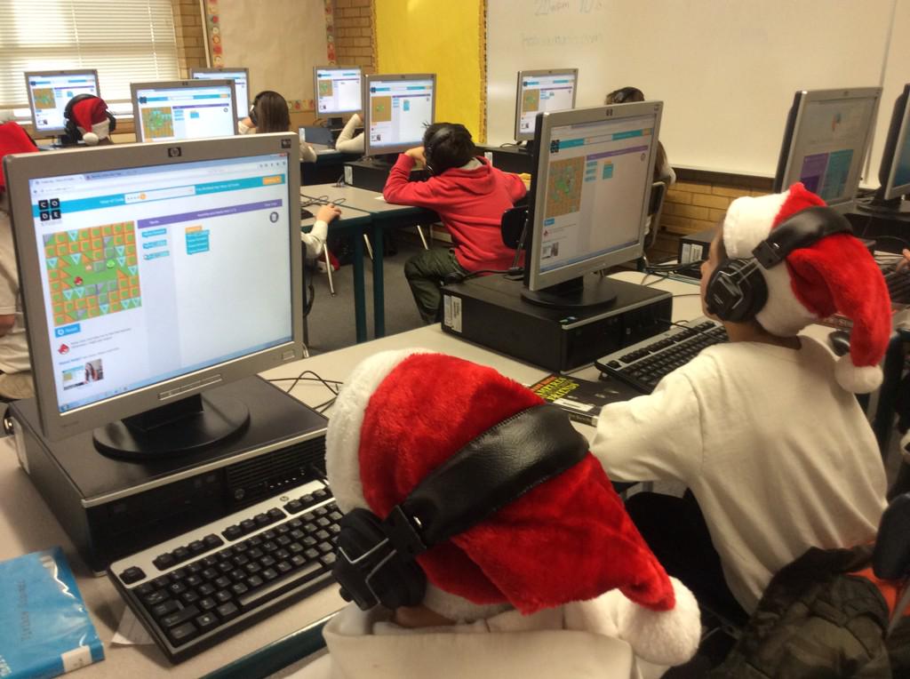 randysfox's tweet image. Mrs. Mathews, Santa hats, and Hour of Code!  #edtechcontest @EdTechGSD