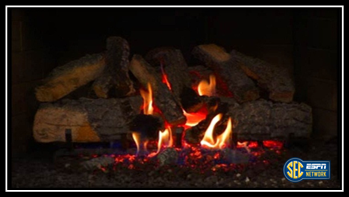 bmarcello's tweet photo. SEC Network will show a Yule Log w/  fight songs and Christmas music from 5-9 a.m. CT on Christmas Day http://t.co/ZPYpcW3p6n