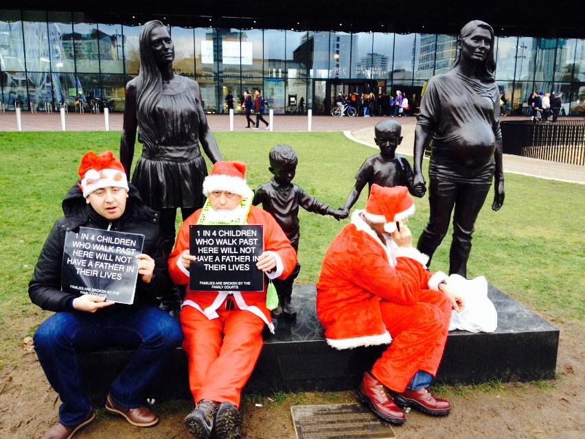 philmackie's tweet photo. @F4JOfficial protest. Santa padlocked to the "Real Birmingham Family" Statue by Wearing http://t.co/0HwO417kTU