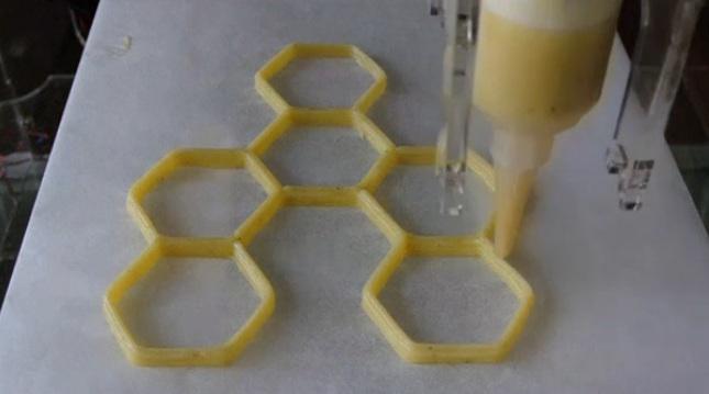 Reuters's tweet photo. We've officially entered the age of the 3-D cookie printer, in today's Reuters FYI: http://t.co/KcmaMOfYZj http://t.co/WCnDvkkb9y