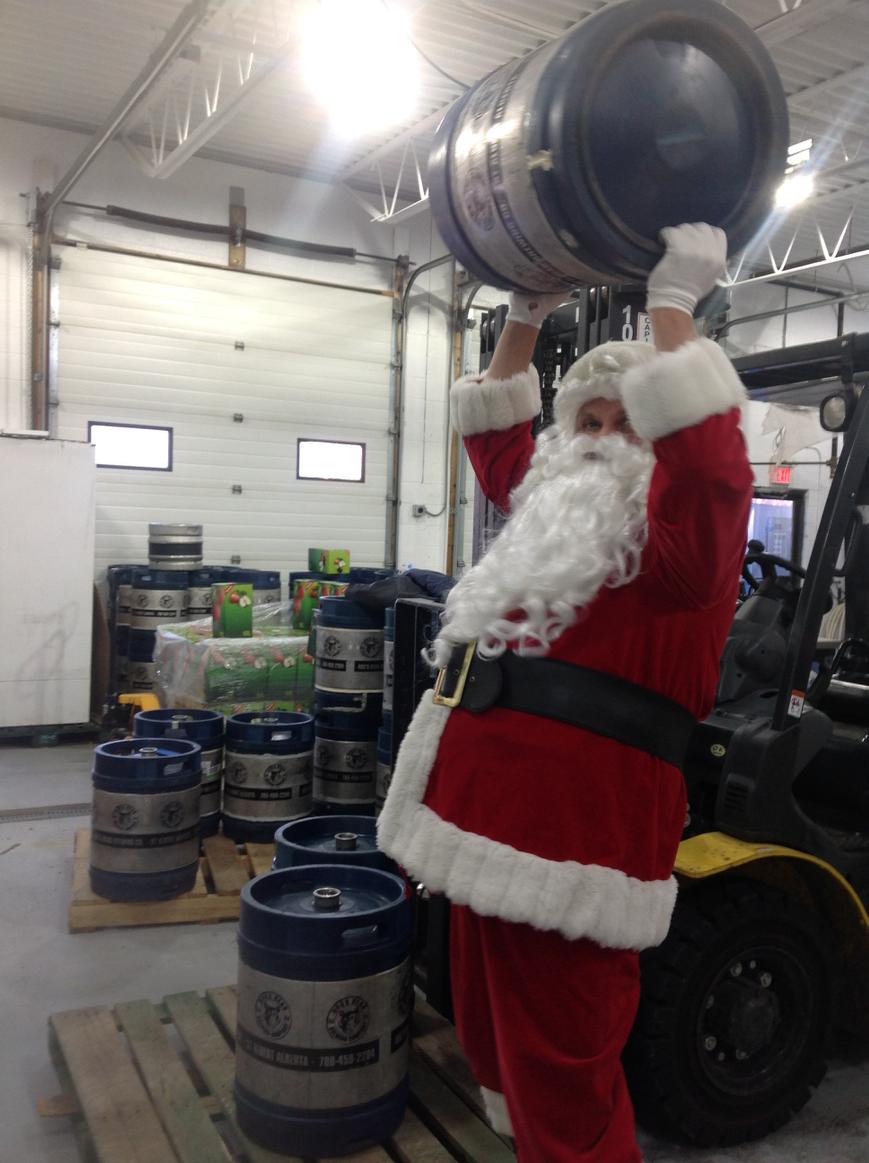 Santa working out so he can lift all the gifts.
