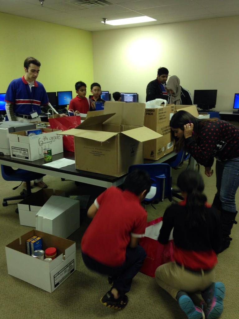 hsidallas's tweet photo. Harmony students of all ages preparing holiday food boxes for @Metrocresthelps #donate http://t.co/aibjIweHF7