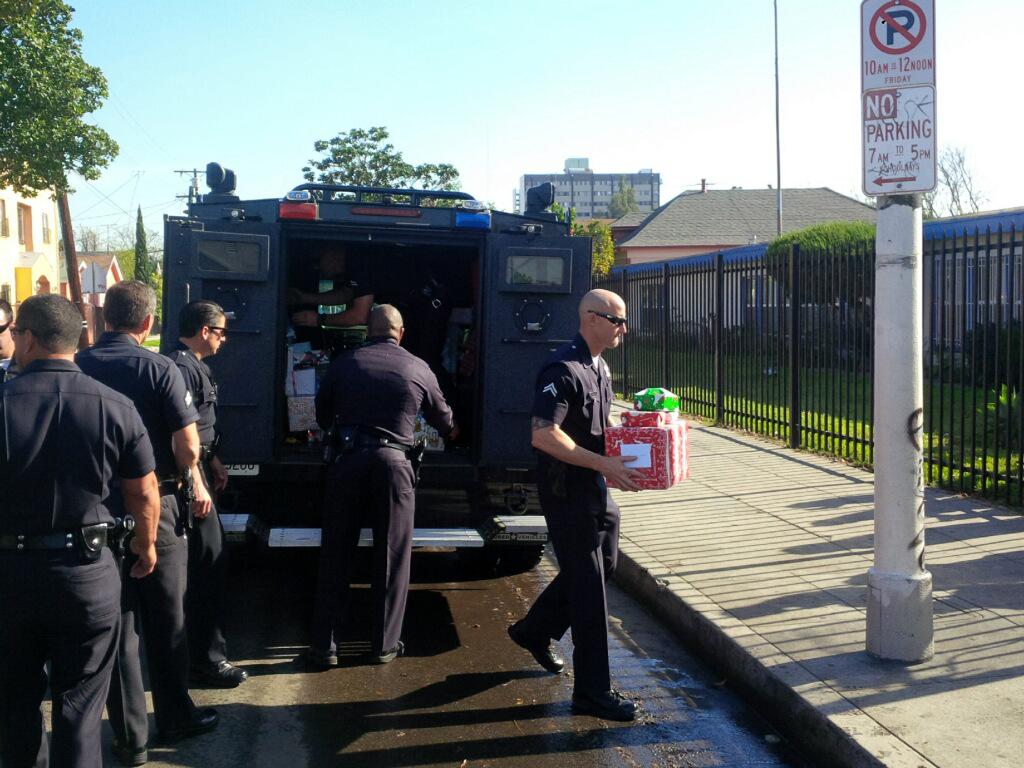 LAPD SWAT offering the simplest of holiday gestures to make a needy kid smile. #presents #goodguys