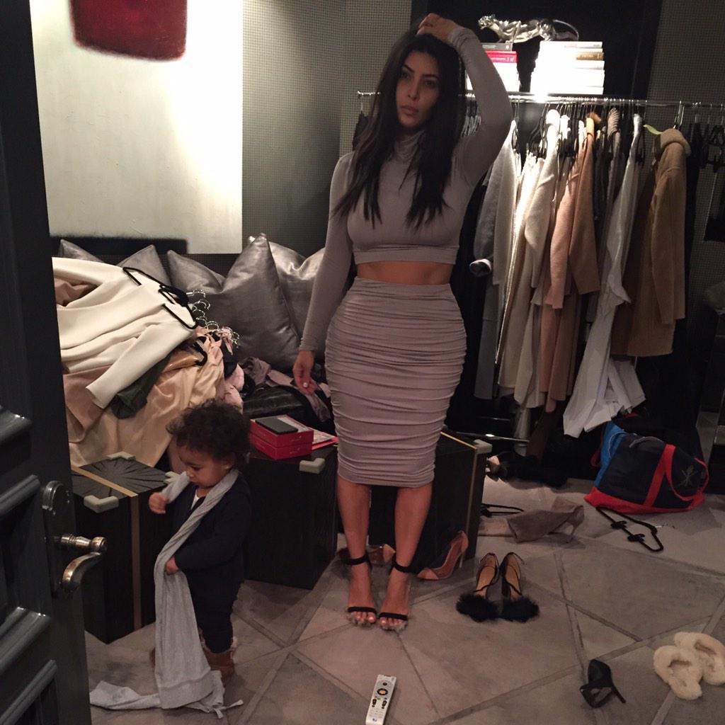 KimKardashian's tweet image. yesterday...trying to pick out an outfit struggle
