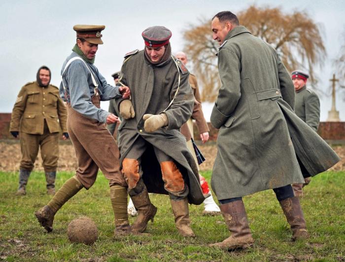 guardian's tweet image. Volunteers re-enact the Christmas truce football match - in pictures trib.al/BjCqIOc