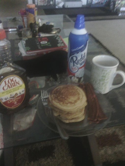 Christmas breakfast of peanut butter and cinnamon pancakes, turkey bacon with cranberry juice.Syrup or