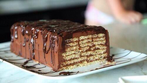 "..." Walks over to <a href="/mrvldrstark/">Gregory Stark</a>. "Merry Christmas..." Hands him a KitKat cake.