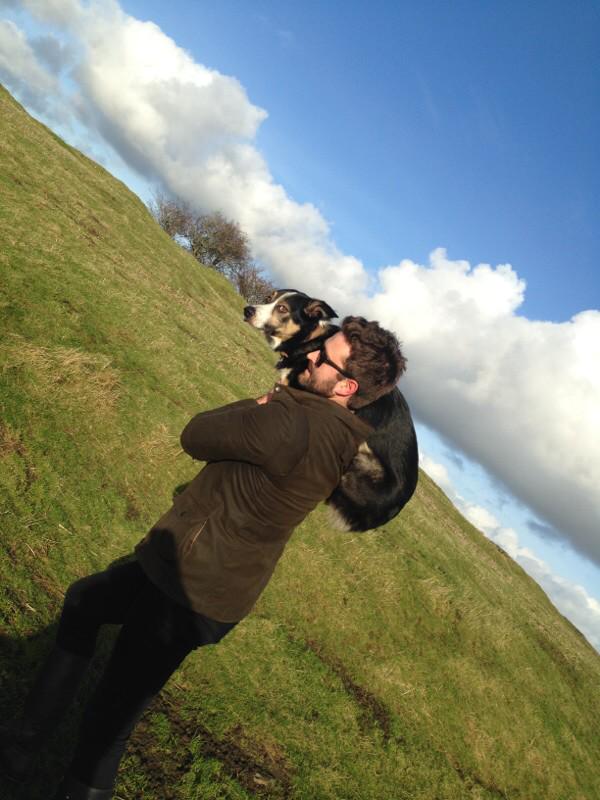 MrGarethMorgan's tweet photo. Xmas day walk ended in a collie with a sprained leg. Had to carry him back in his favourite way: rocket launcher dog http://t.co/jwALEngGrV