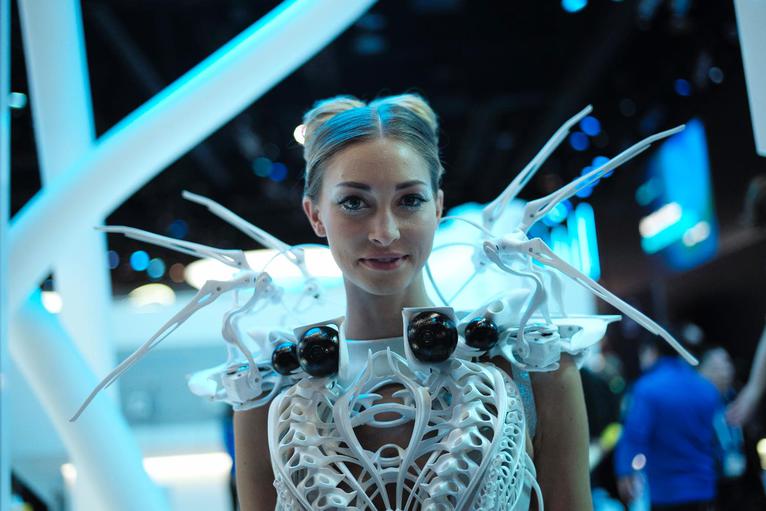 A model wears a robotic dress with proximity sensors at the International Consumer Electronics Show.