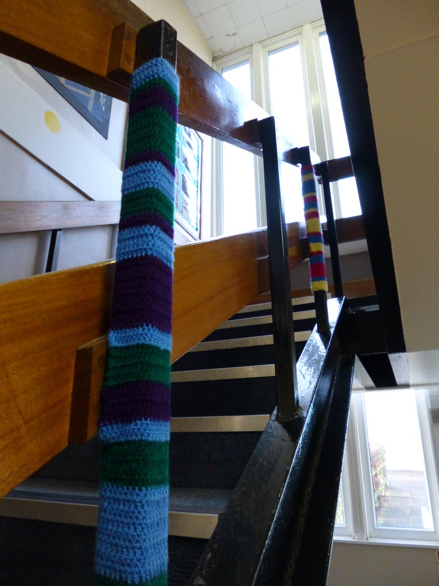 Backwell_School's tweet image. The stairs outside Mr Baldwin&apos;s office have been #yarnbombed for a GCSE Art project. We love the new colourful stairs