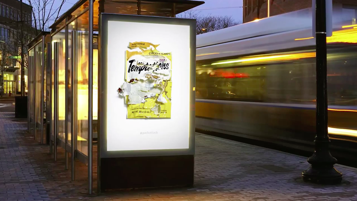 AdFreak's tweet photo. Ads show how cats just absolutely destroy bags of Temptations treats in a ravenous fury. http://t.co/YrRCL05r0J http://t.co/LYVeG1nAMW