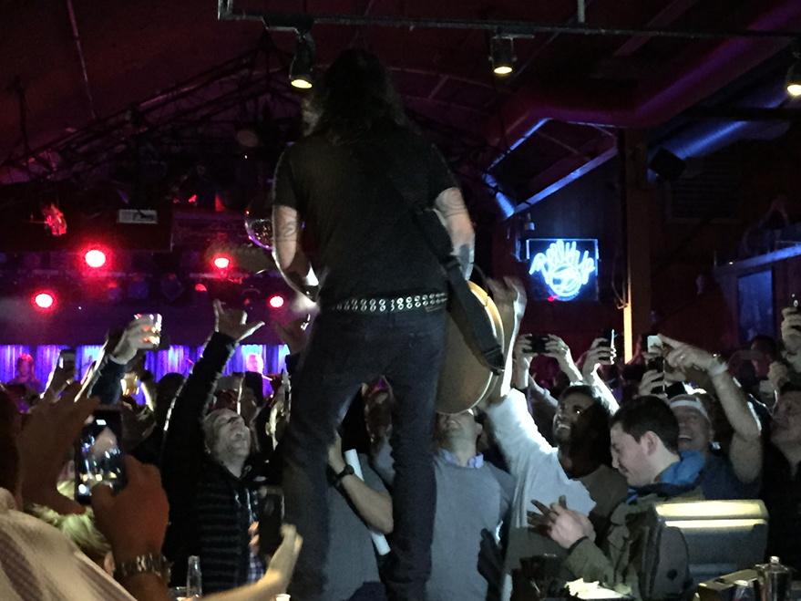 mrdavidkarp's tweet photo. Dave Grohl on the bar prior to a shot of tequila during the Foo Fighters performance. #wme15 http://t.co/HFpaJPKKnS