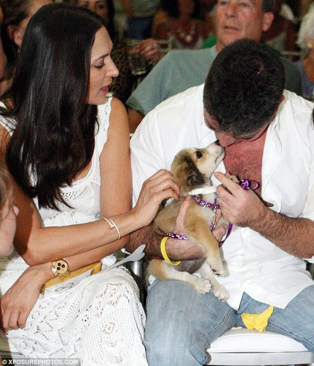 JustSimonCowell's tweet photo. Simon Cowell and guests attend the #K9Friends charity auction in Barbados. More pics: http://t.co/auwMvaDT4b http://t.co/ojcOssVgc8