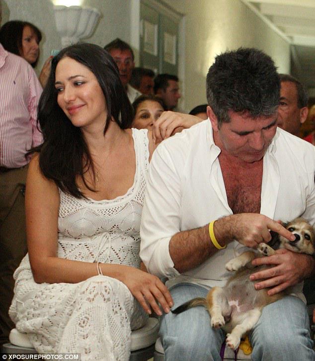 JustSimonCowell's tweet photo. Simon Cowell, Lauren &amp; guests attend a dog charity auction in Barbados. More puppy photos: http://t.co/CigSnGXXBI http://t.co/x0LRpZx9i0