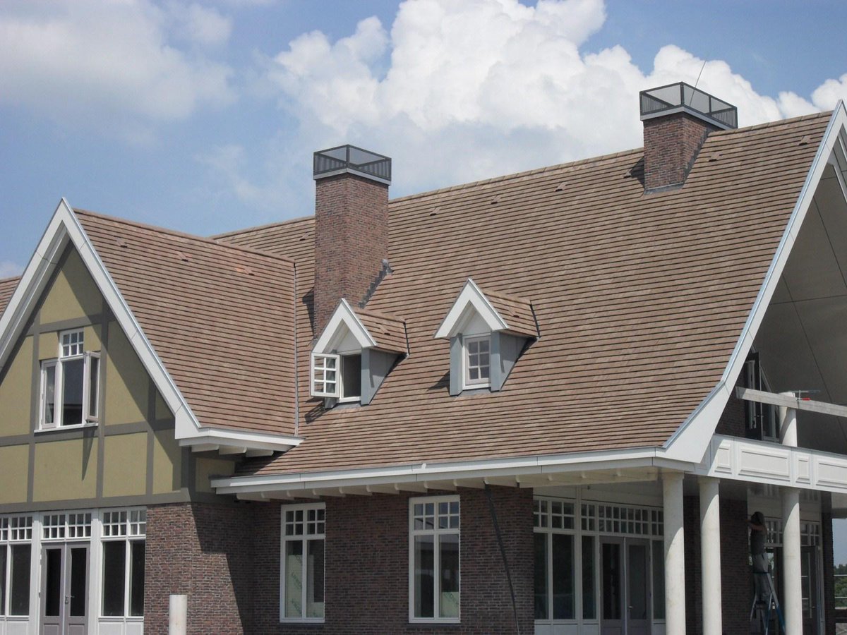 Imerys Plate 27x41 Non Interlocking Plain Tile on a Golf Clubhouse roof in Spijk Holland. More info : info@pgsbv.nl