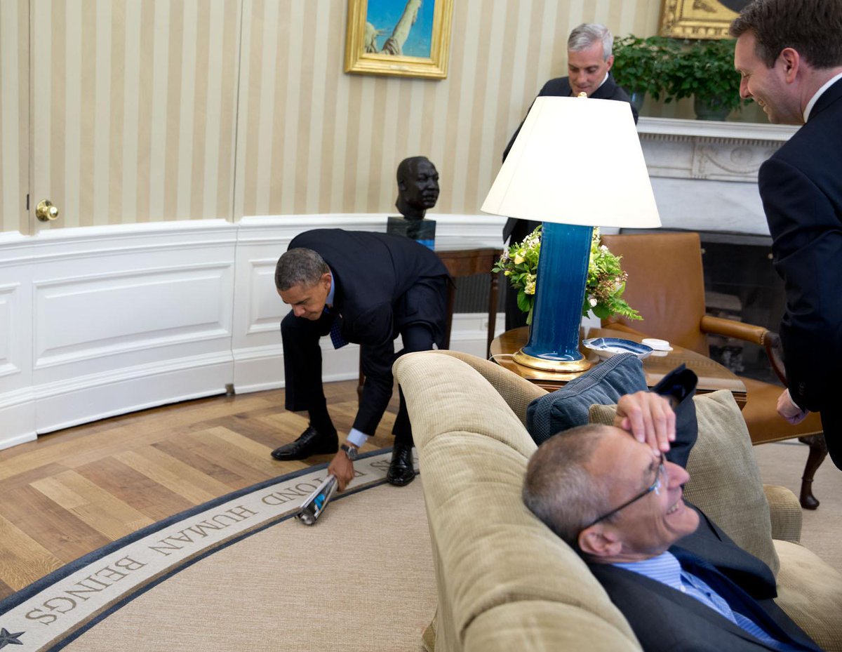 "Aides laugh as the President swats a fly that was invading his space in the Oval Office." (Official White House Photo by Pete Souza)