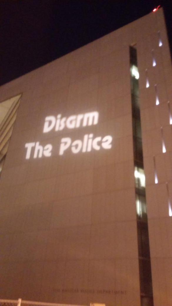 pentagonista's tweet photo. New decor on #LAPD HQ.. #BlackLivesMatter #EzellFord http://t.co/fHzcWsTIaD