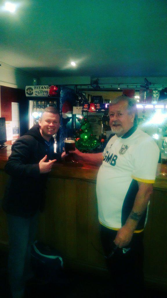 Making friends in the the Vale club bar. Forced to smile.
