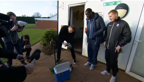 BBCSport's tweet photo. Watch Paddy McGuinness clean Emile Heskey's boots after Twitter post backfires http://t.co/AvAosk8S4f http://t.co/Fb7rBa78NB