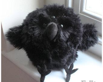 Cuddles her three eyed raven plush she received from a small boy. "No Seductive Sunday today."
