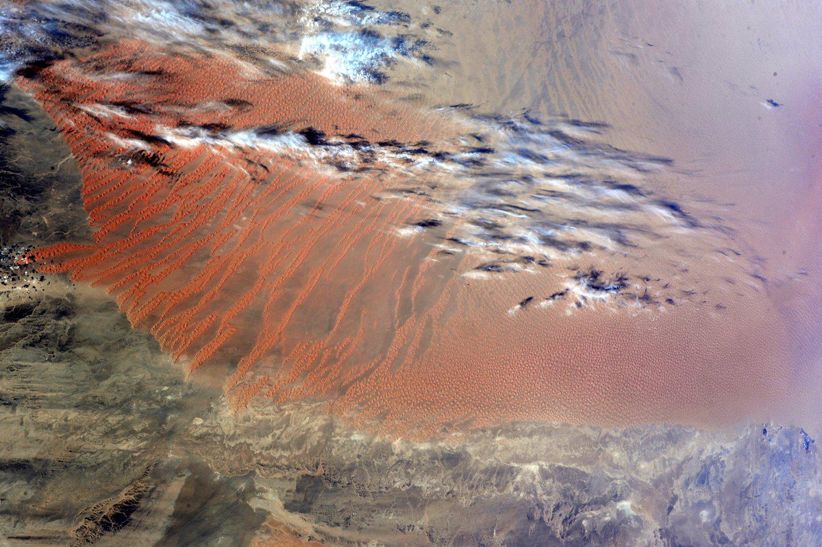 AstroSamantha's tweet image. The characteristic red patterns of some Sahara regions. Always a mesmerizing sight. #ColorsOfTheEarth #HelloEarth