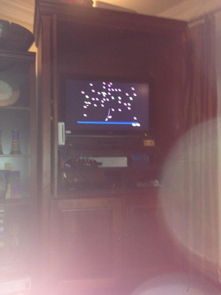 Grammunition's tweet image. @Atari2600Gamer playing centipede on the Atari 5 system from Christmas #solidfun #80sgames