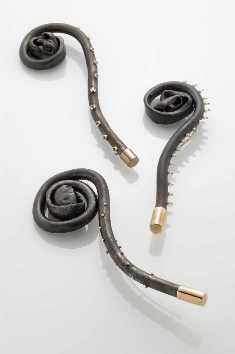 mcveighdesign's tweet photo. Forged steel fiddlehead lapel pin/brooch. hand forged, 18k gold, akoya seed pearls $935 @mcveighdesign http://t.co/s5DPVg3Dql