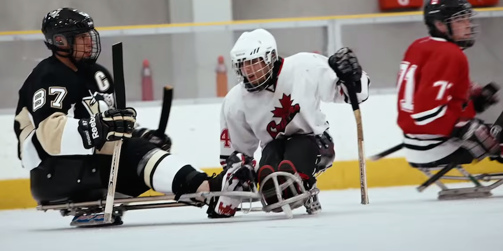 theScore's tweet photo. VIDEO: Sidney Crosby, NHL stars give sledge hockey a try. http://t.co/jgvD3jlJ4X http://t.co/6FyDqstiO6