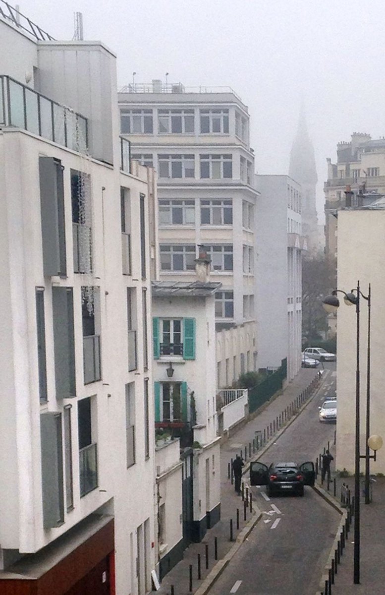 CNC_World's tweet photo. Death toll rose to 12 in Paris shooting at Charlie Hebdo HQ on Wednesday,a Paris prosecutor said.(AFP Photo) http://t.co/9MQH4CPVMS