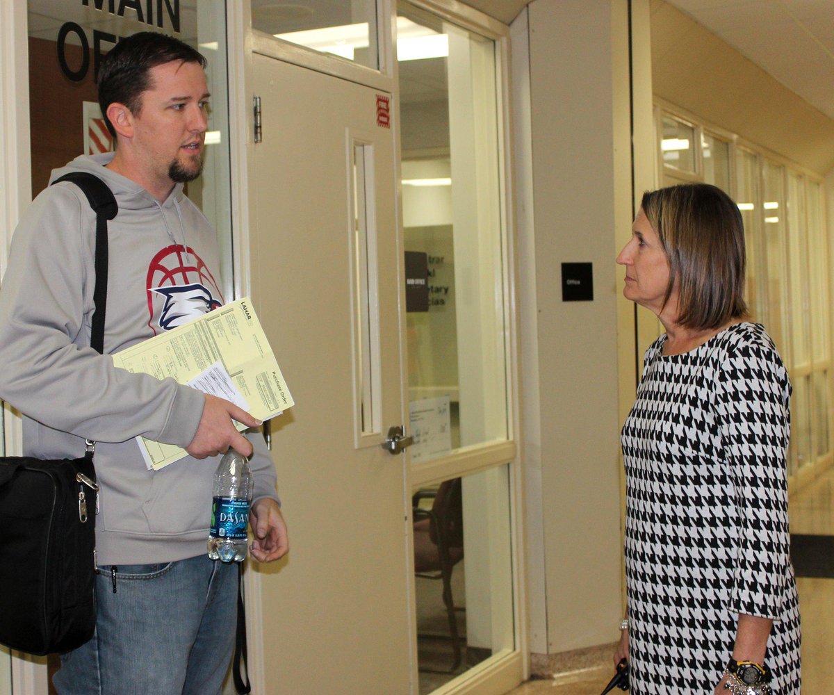 THS Principal Dr. Vera Wehring chats with Michael Jackson before helping a teacher. #APrincipalsDay