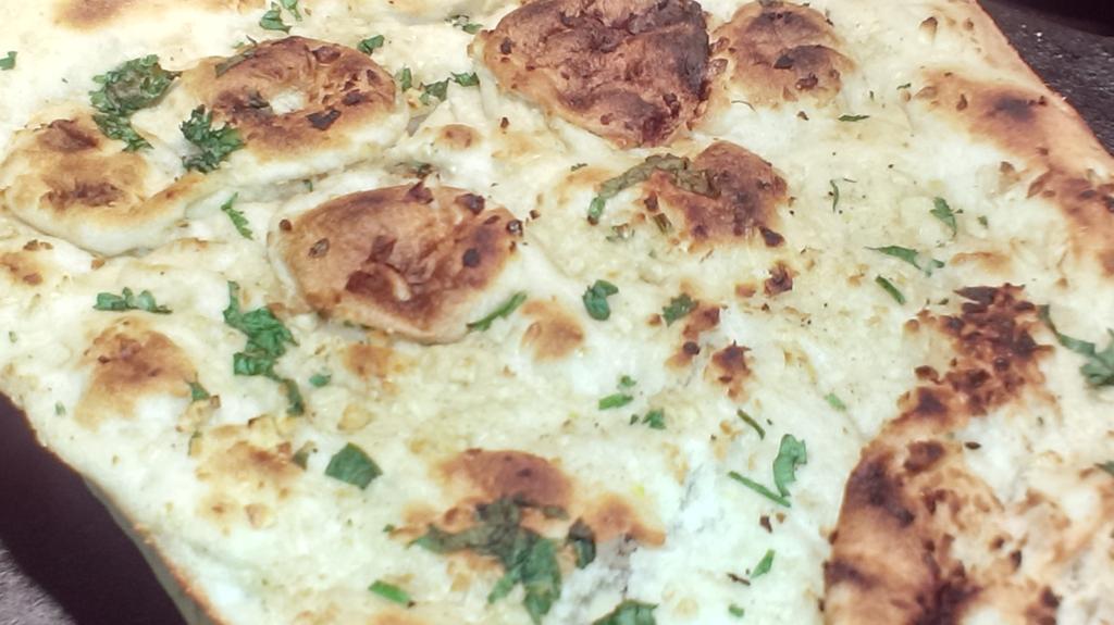 AAPremlall's tweet image. Vampire-Free Cooking: Local kale with baby bella mushrooms, garlic smashed potatoes, bigan choka, and garlic naan. 😋