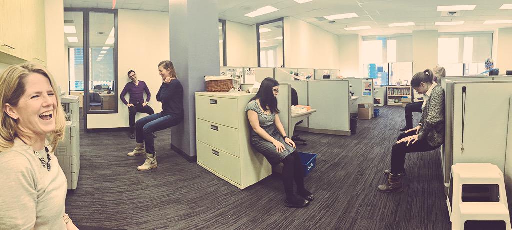 ParticipACTION's tweet photo. Shh, nothing is happening over here...just a little healthy wall-sit competition. #WorkplaceWellness #fitbreak http://t.co/tlw556lVUQ