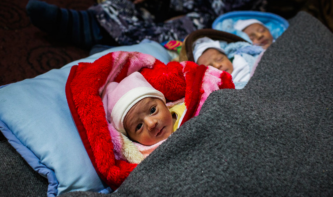 Refugees's tweet photo. Syrian triplets born on New Year's Day begin their lives as motherless refugees. http://t.co/cI1wlxYwfk http://t.co/X3sCC4YTVc