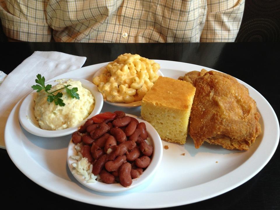 Fried chicken, corn bread, and sides (mashed potatoes, red beans and rice and mac &amp; cheese). Photo by Maggie M.