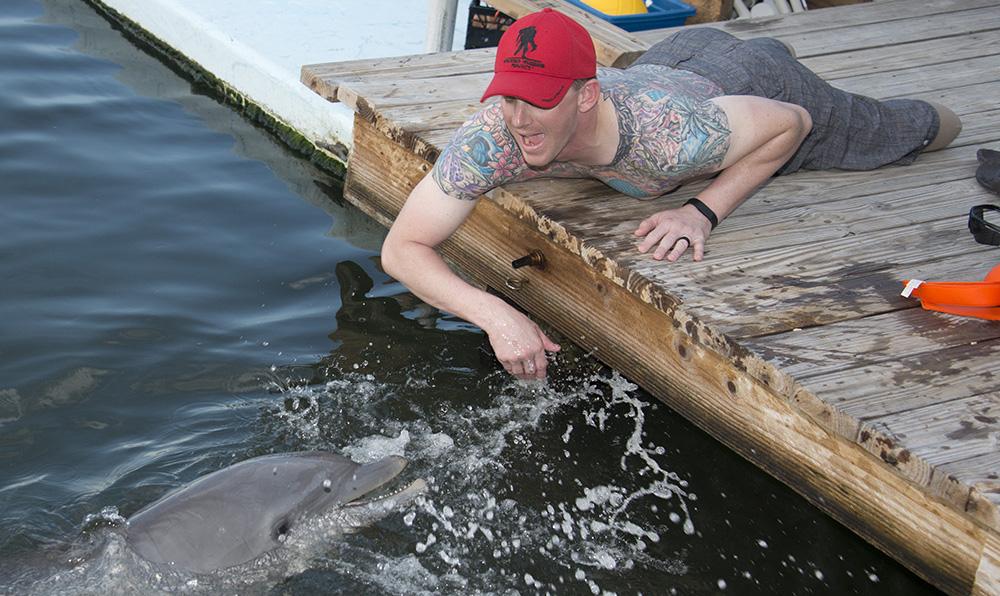 nbc6's tweet photo. Wounded warriors swim with dolphins, bike across bridge in Florida Keys: http://t.co/jM3AJJoikR http://t.co/MykY1A88zz