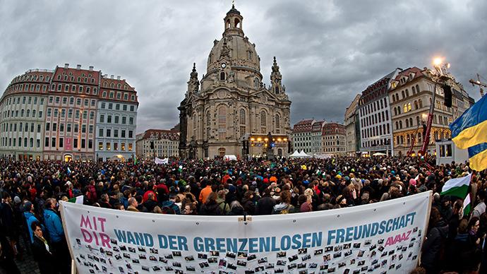 RT_com's tweet photo. #Lovestorm: 35,000 protest racism, xenophobia in Germany’s Dresden http://t.co/VqmGl4ngqF http://t.co/20Lxaagn1Y