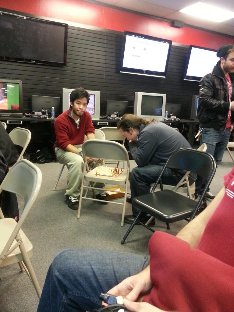 oracletx's tweet photo. These dudes playing chess at #hitstun! Smash 64 confirmed classiest smash community http://t.co/KLtzedgLWD